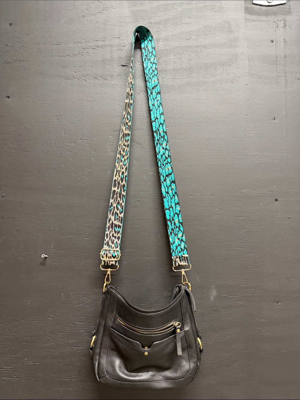 Black Leather Crossbody Bag with Turquoise Accent Strap